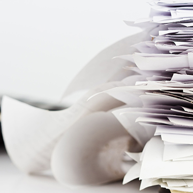 Stacks of receipts or bills on business desk