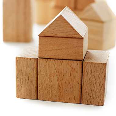 house made of building blocks on white