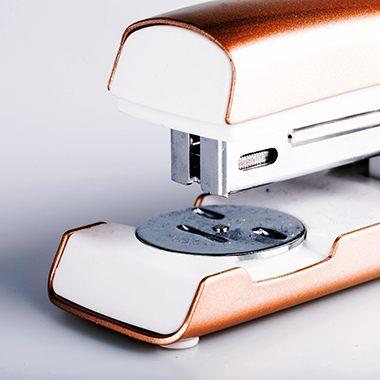 close up of stapler on white
