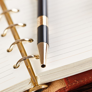 Pen on open notebook