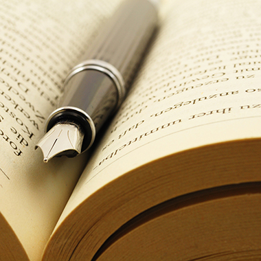 pen in crease of open book