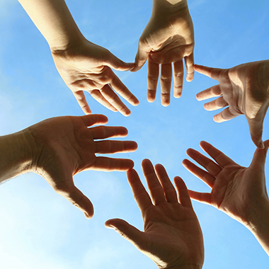 Hands together in sky