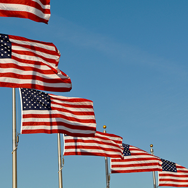 Row of american flags on poles