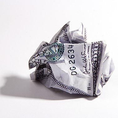 Crumpled Dollar Bill on White Bg