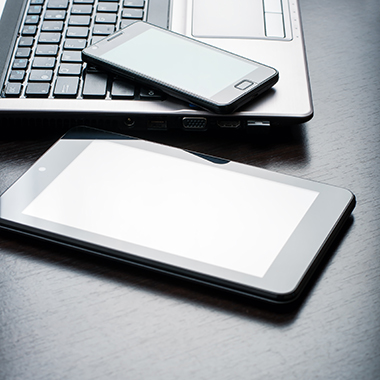 Tablet & Phone On Laptop