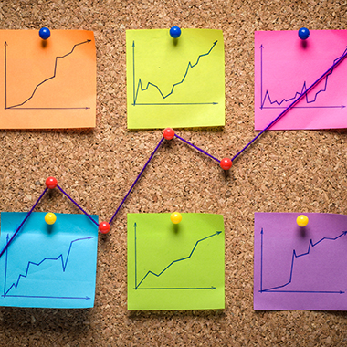 Sticky notes with line graphs