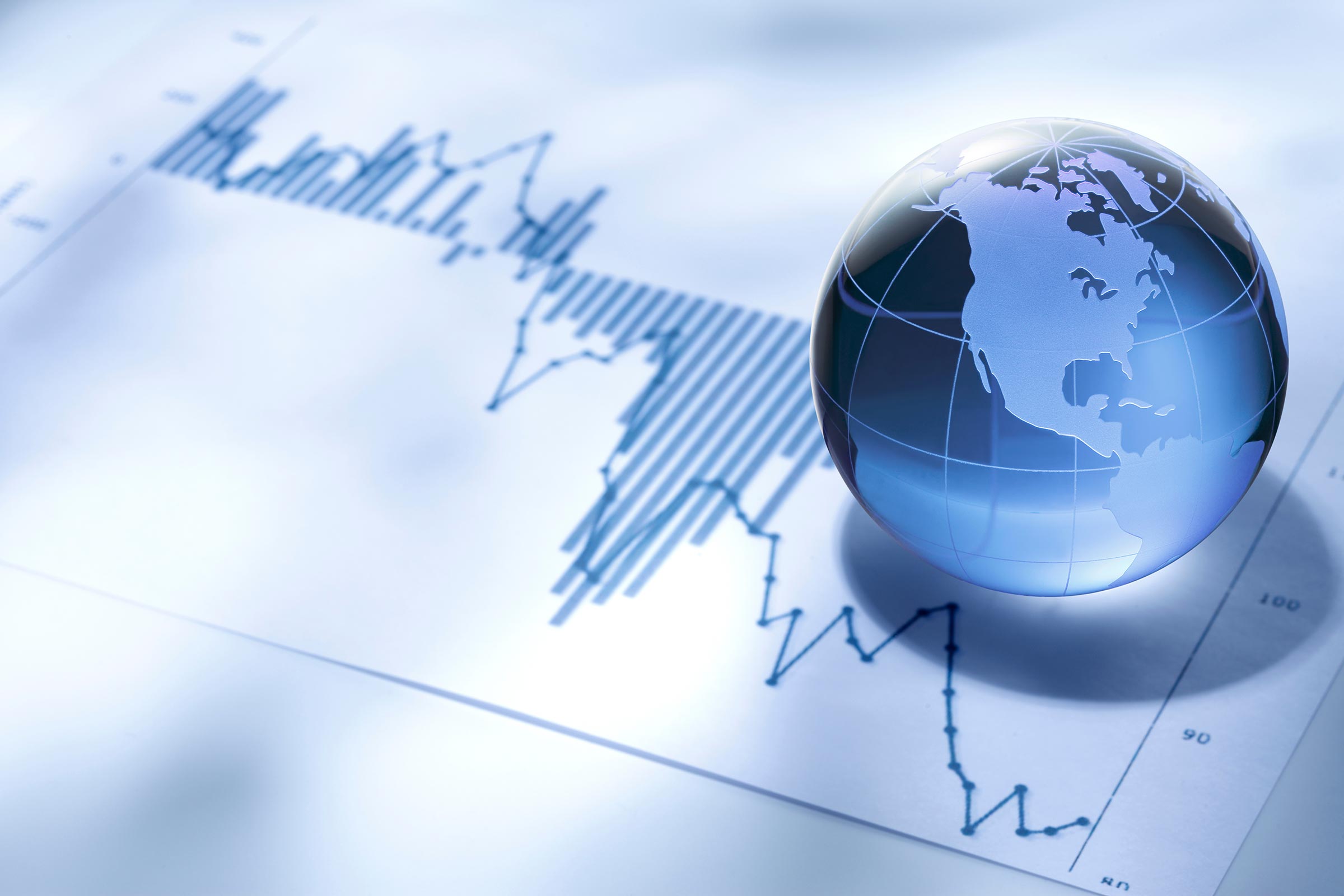 International tax concept with graph and globe