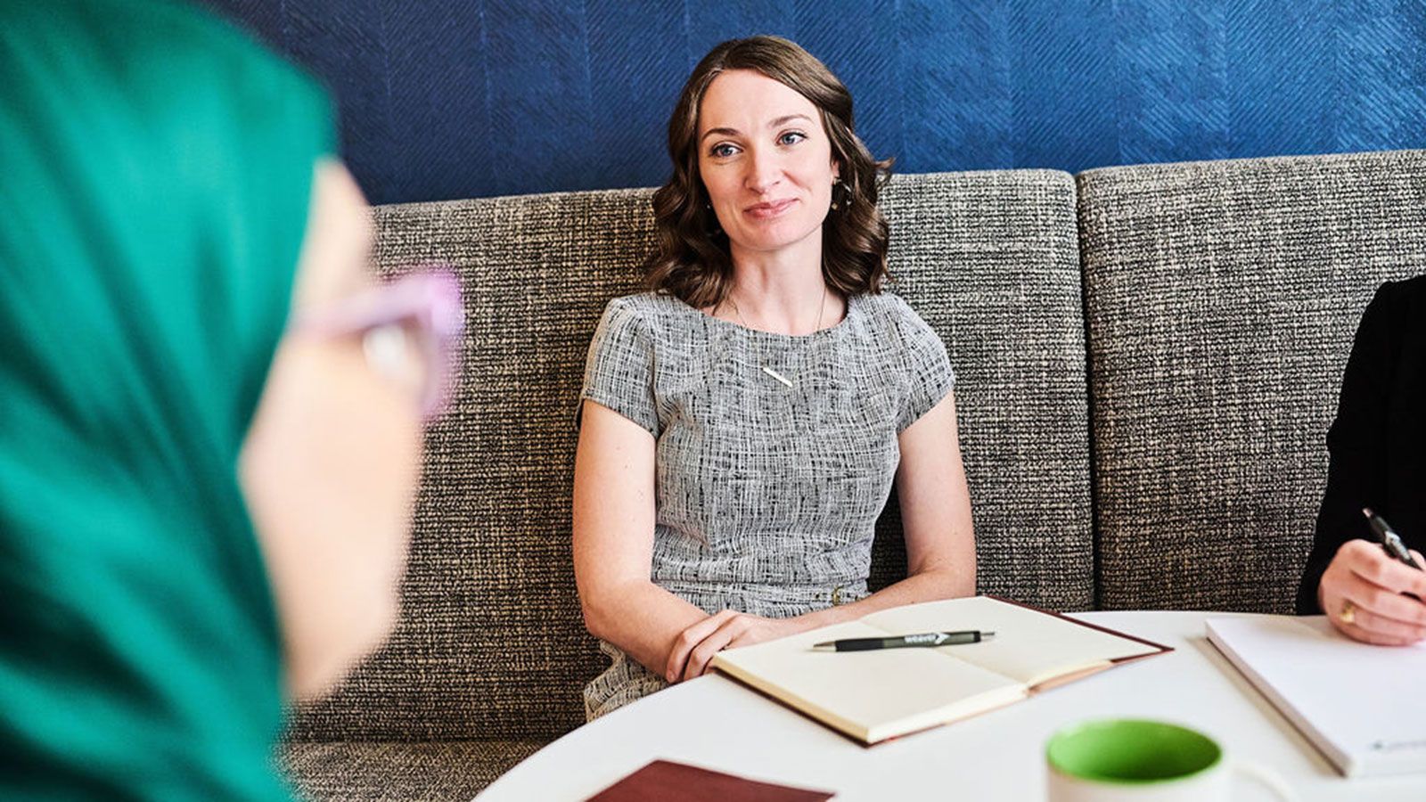 Employee actively listening to coworker
