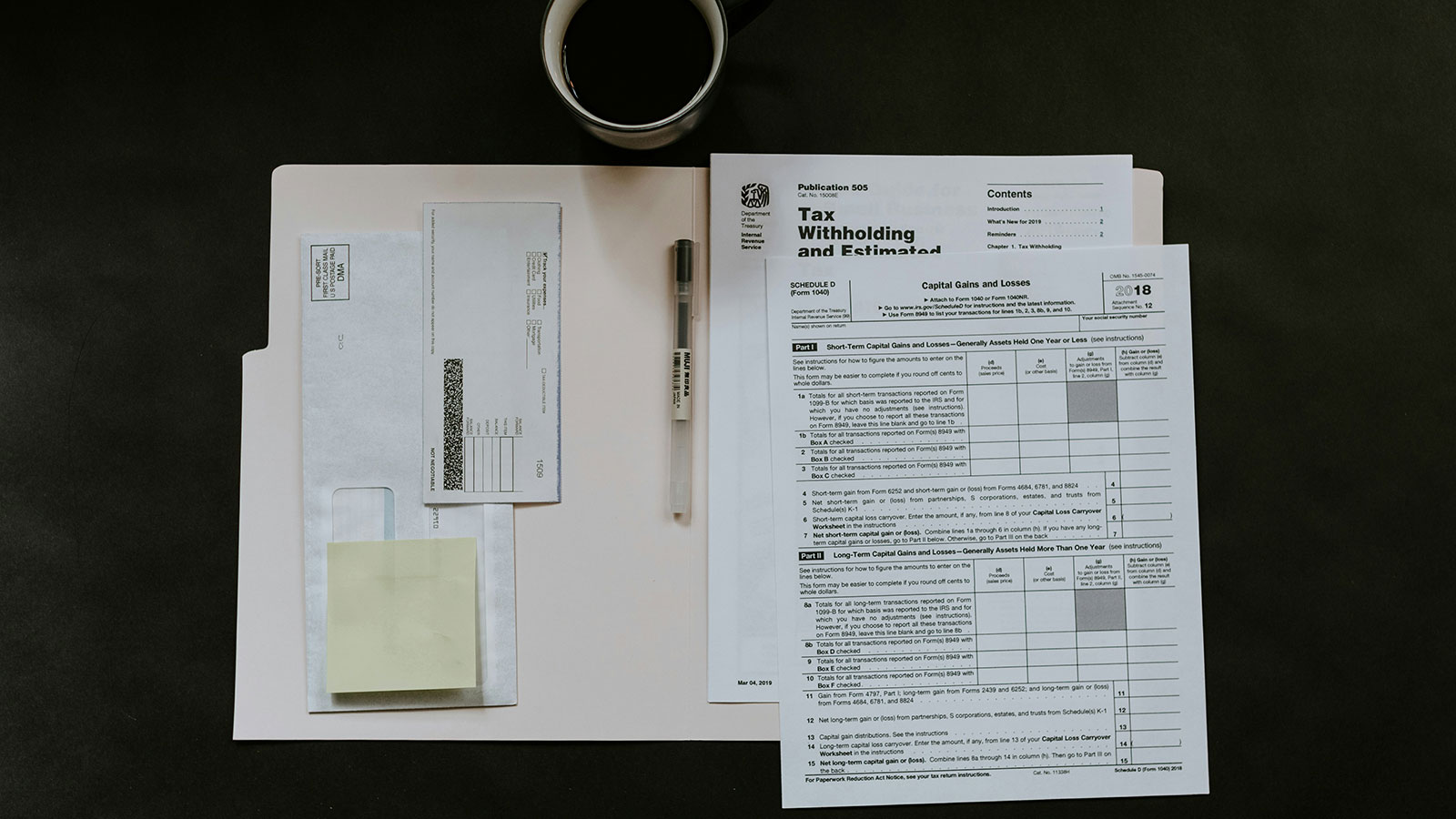 Tax documents spread out on table