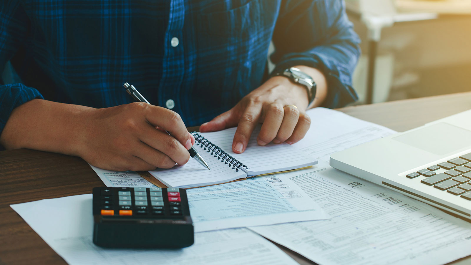 Man doing finances and calculate about cost