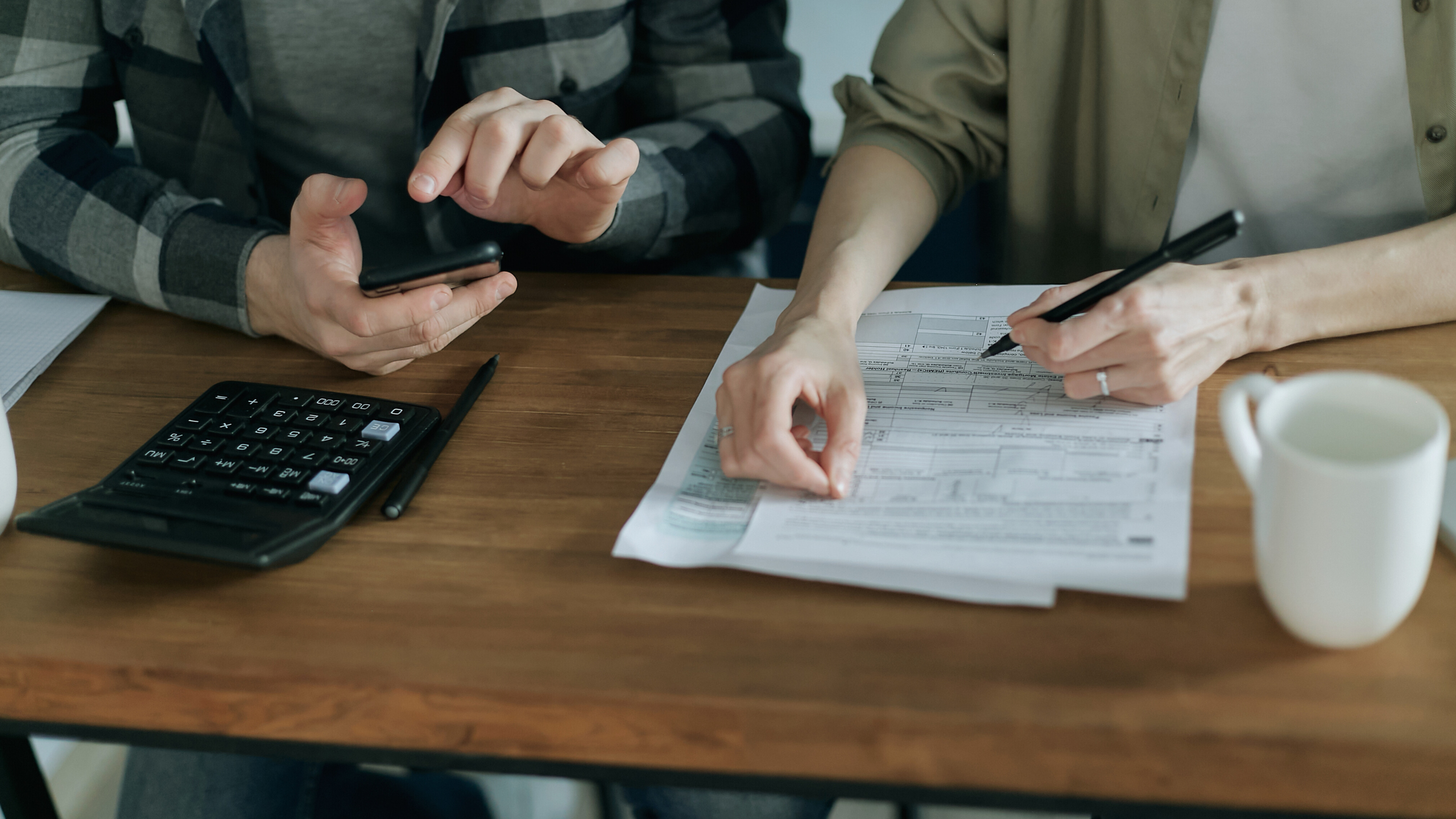 a man and women working on paperwork