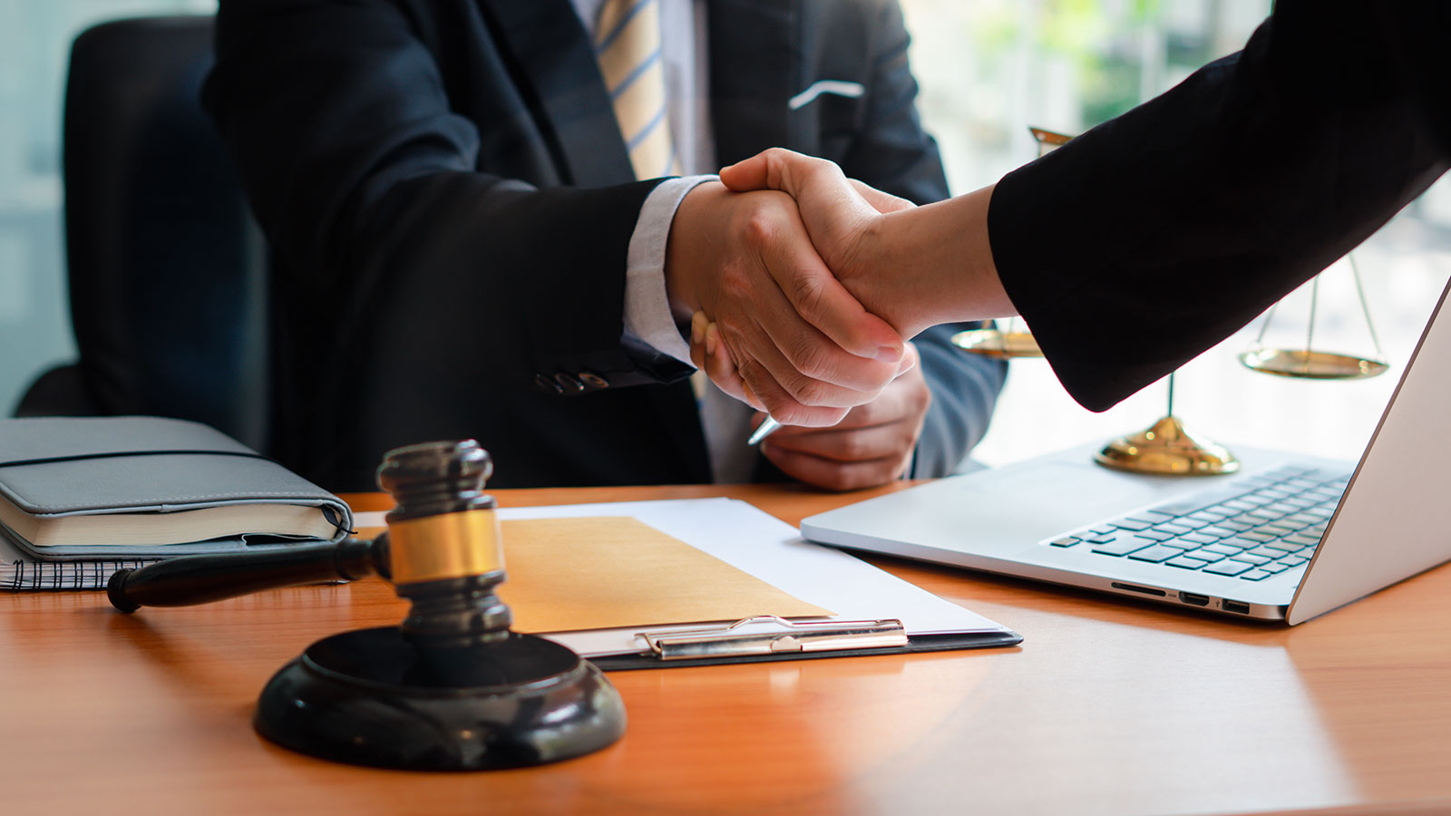 Businessman shaking hands to seal a deal with his partner