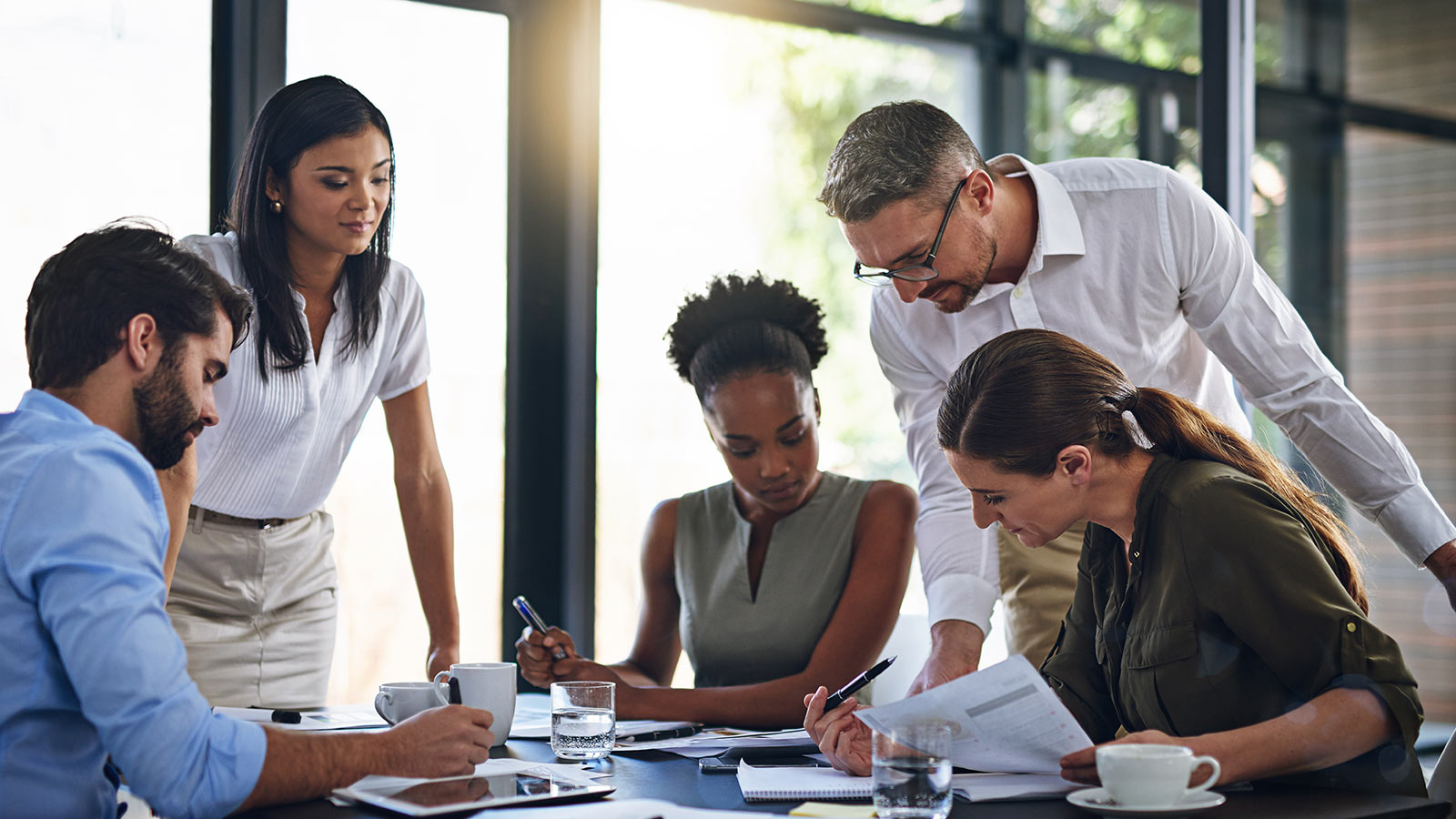 Business people, meeting and budget planning in boardroom for audit and financial logistics with paperwork