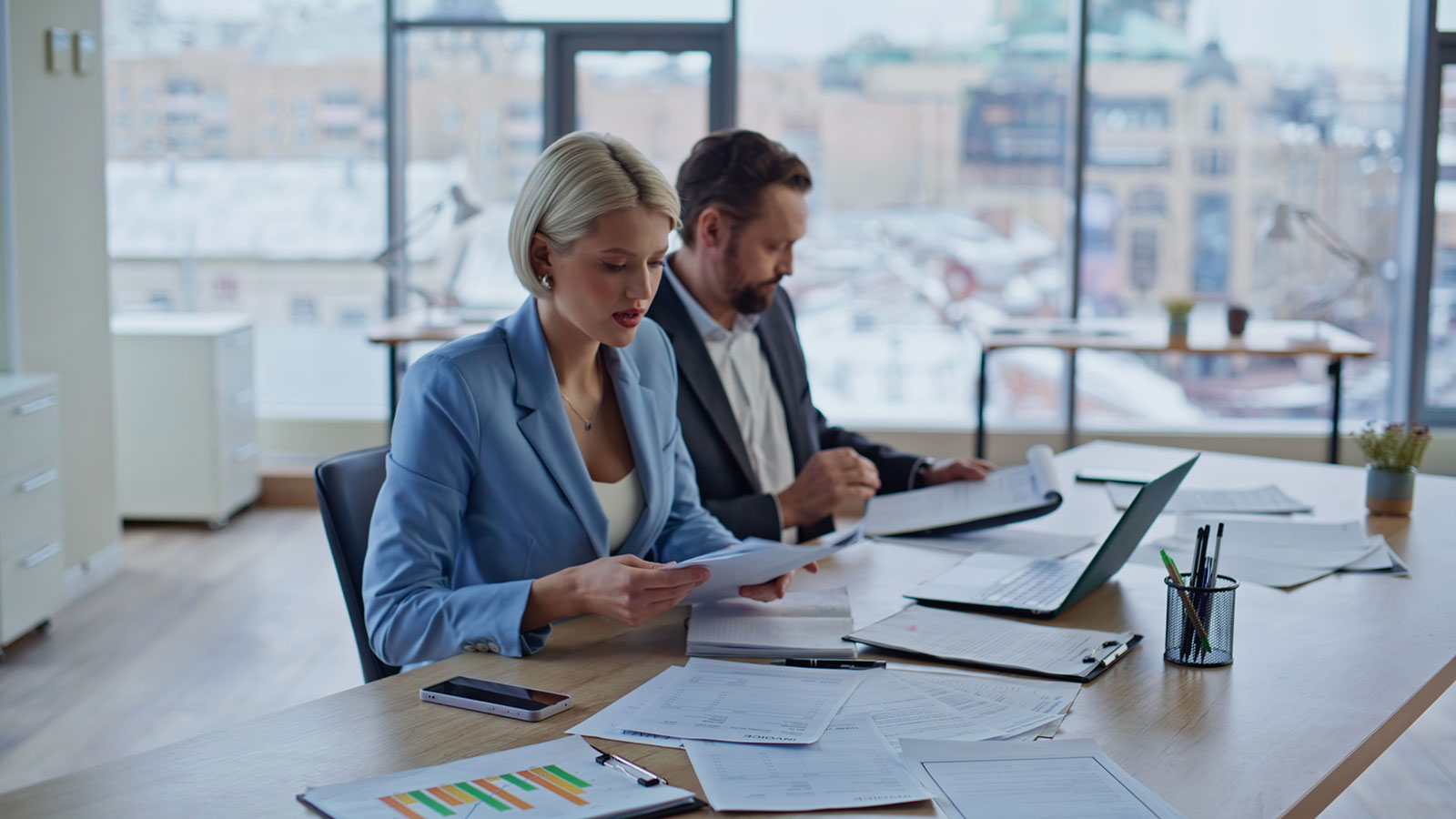 Online accountants talking virtual call at workplace closeup