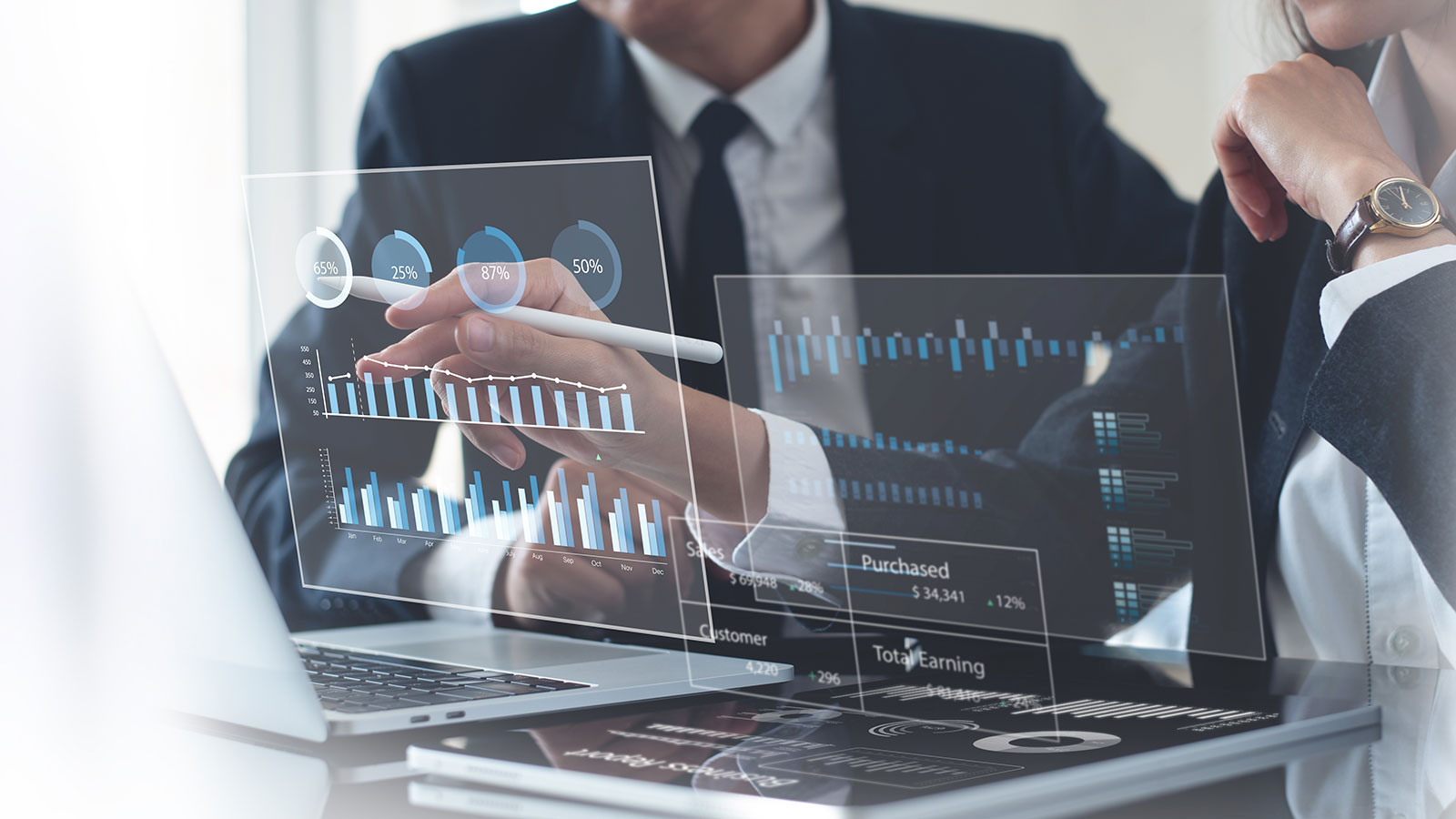 Business team using laptop computer analyzing sales data and financial growth graph chart report
