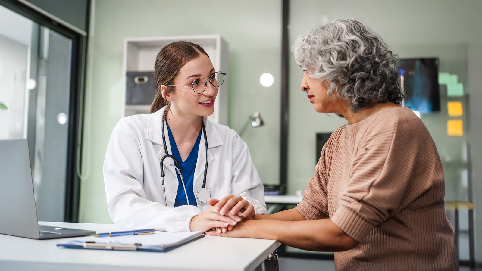 Female psychiatrist sits at her desk, providing mental health consultations