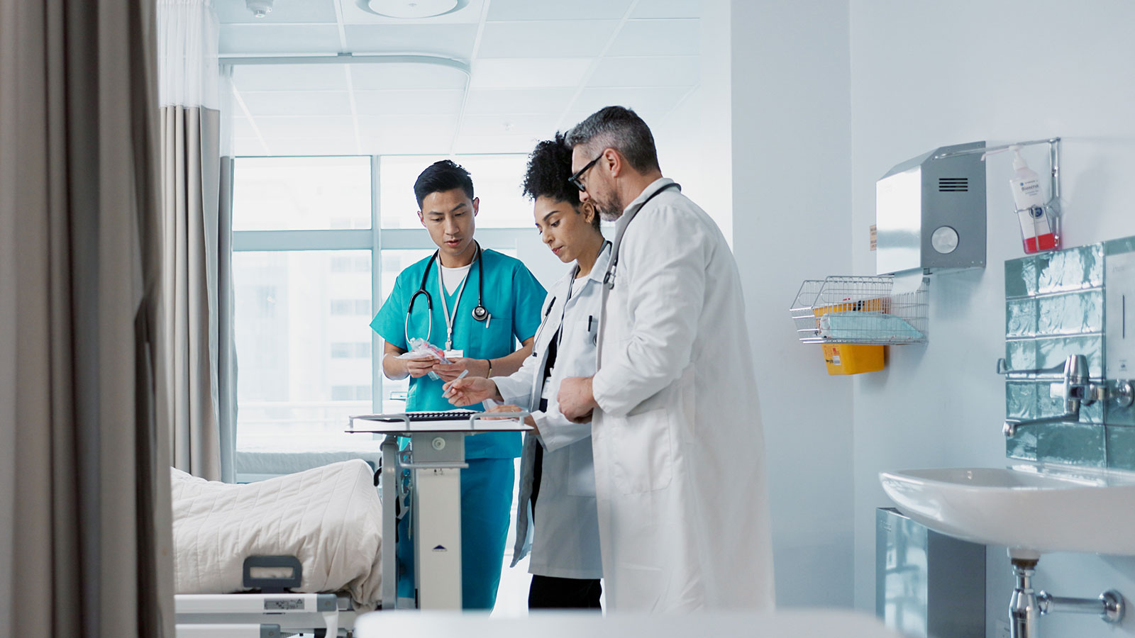 Healthcare, hospital and a medical team of doctors checking on a patient
