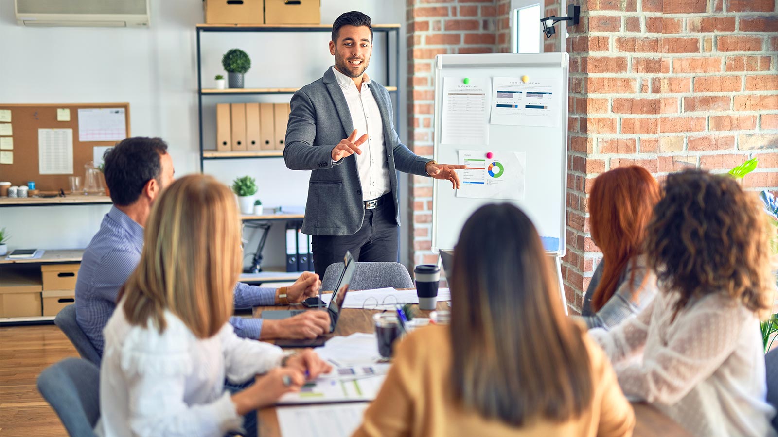 Group of business workers working together in a meeting