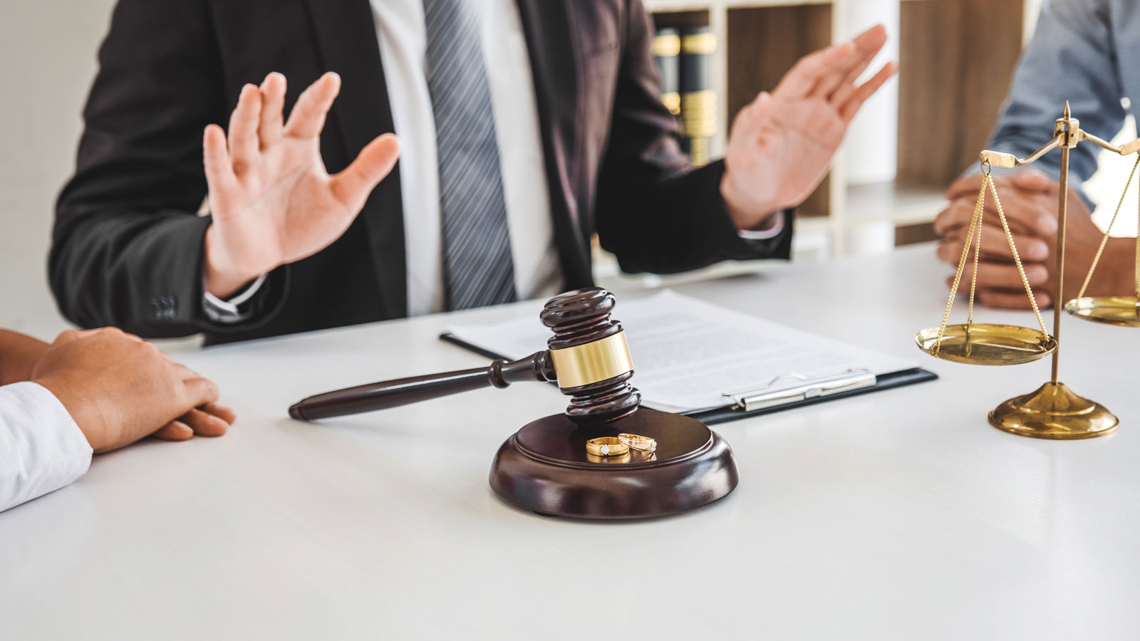 Mediation between marriage, husband and wife during divorce process with male lawyer counselor and signing of divorce contract