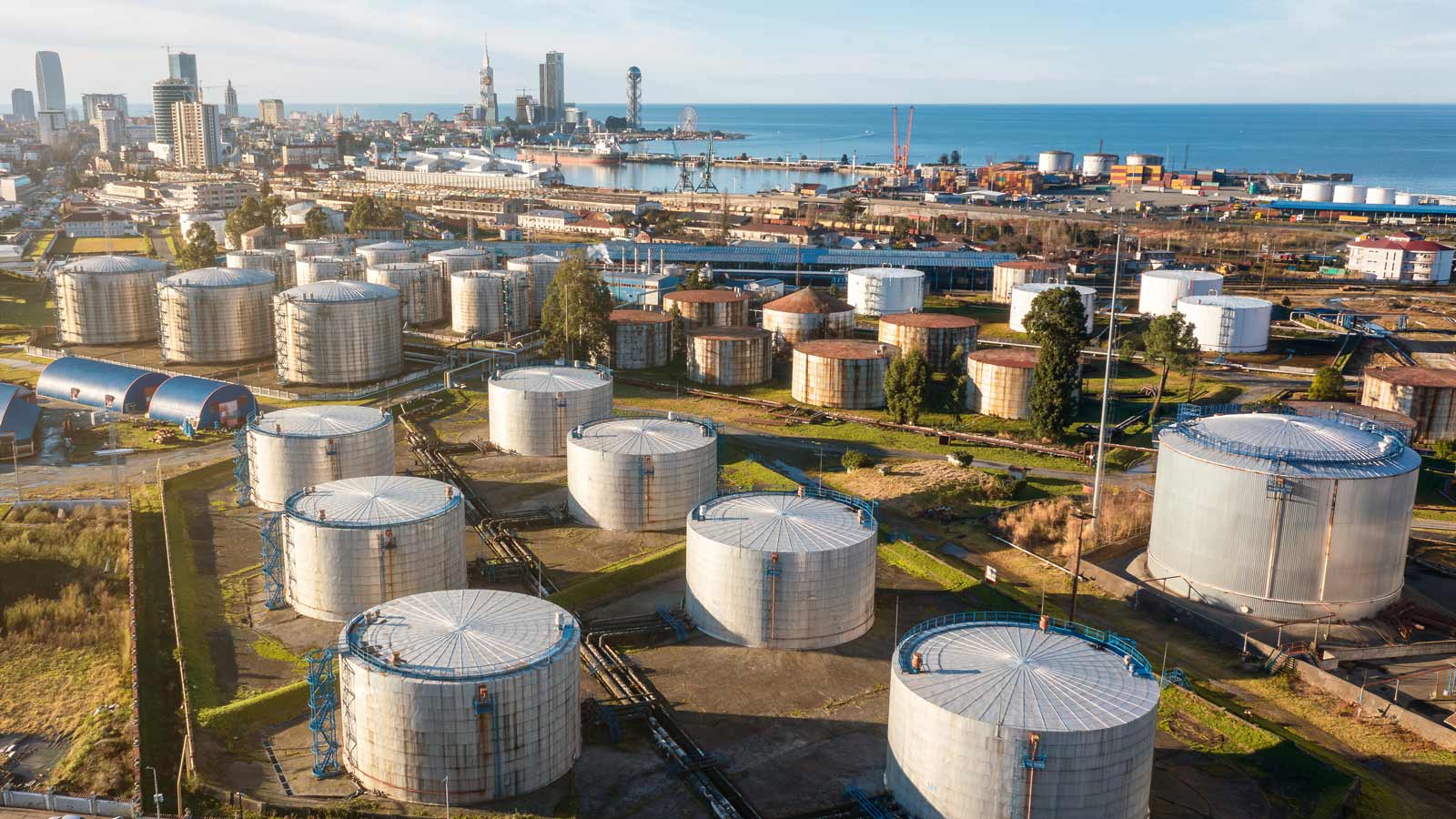 Aerial view of oil and gas terminal with steel storage tanks of oil and LPG petrochemical