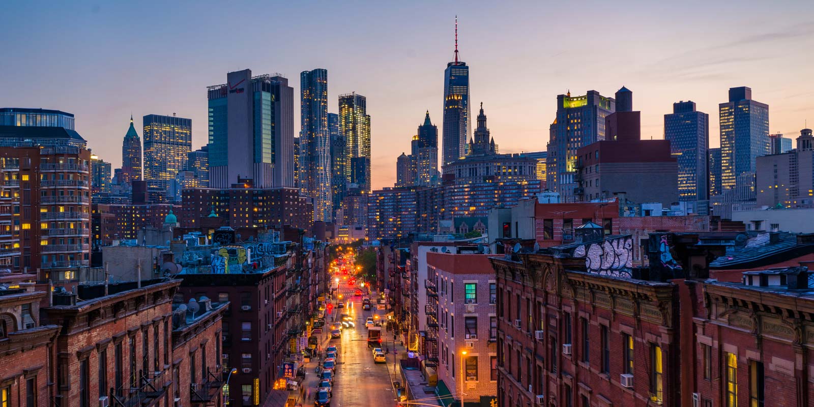 View of Madison Street and Lower Manhattan at sunset from the Manhattan Bridge in New York City