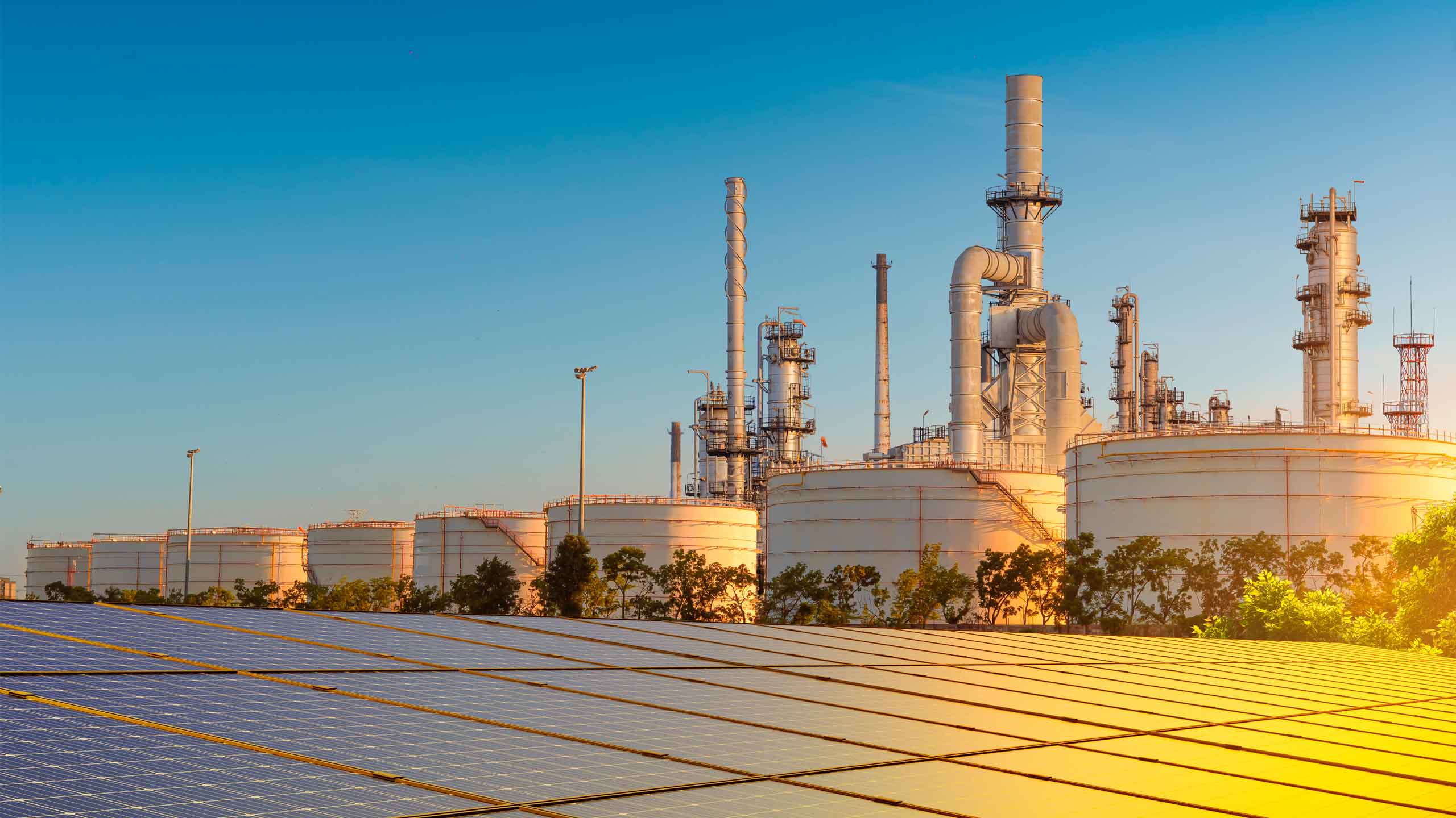 Solar panel and Oil refinery plant from industry zone, large Oil and gas petrochemical industrial