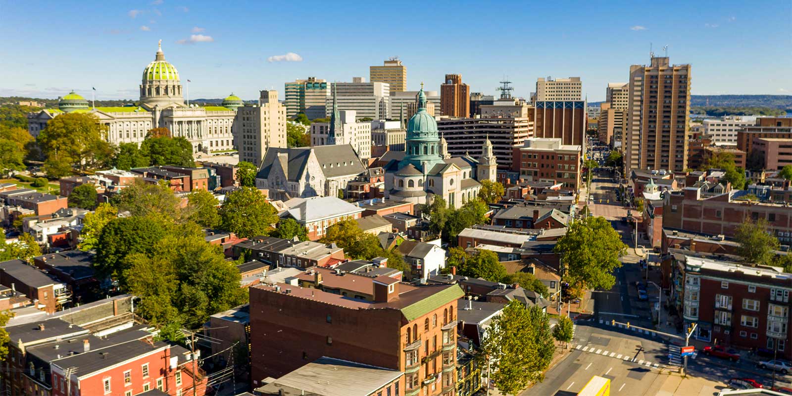 Afternoon light hits the buildings and downtown city center area in Pennsylvania state capital at Harrisburg